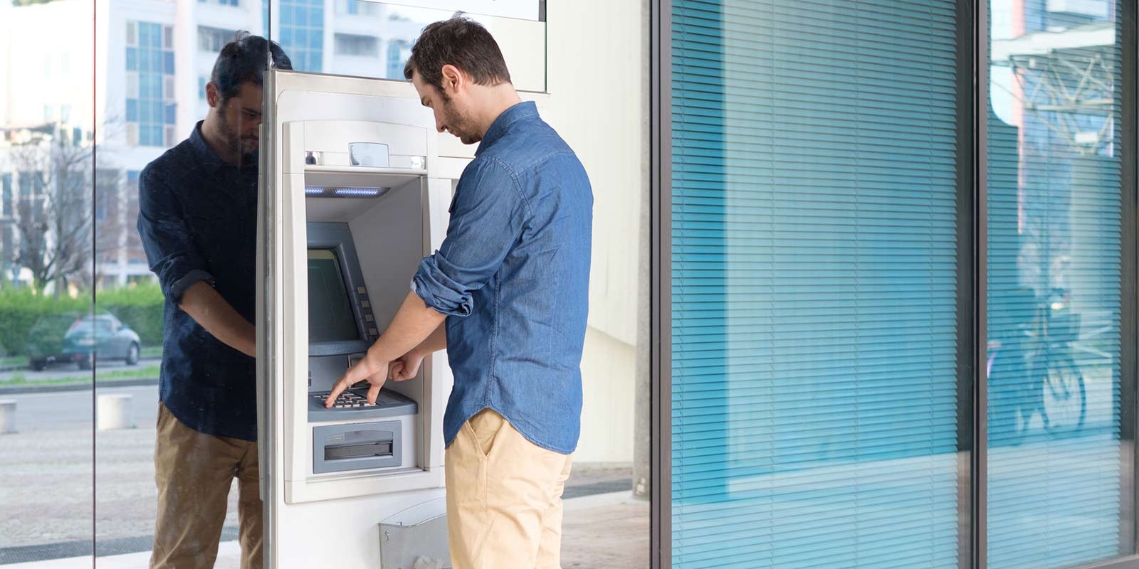 A man using an ATM.